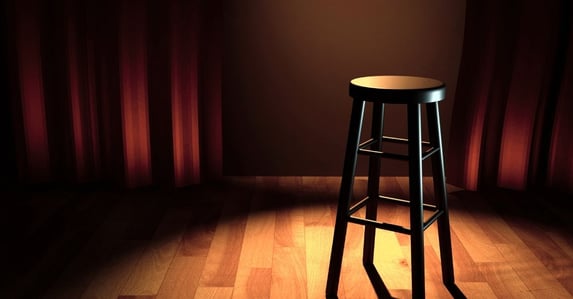 joke of the day for work stand up stool in spotlight